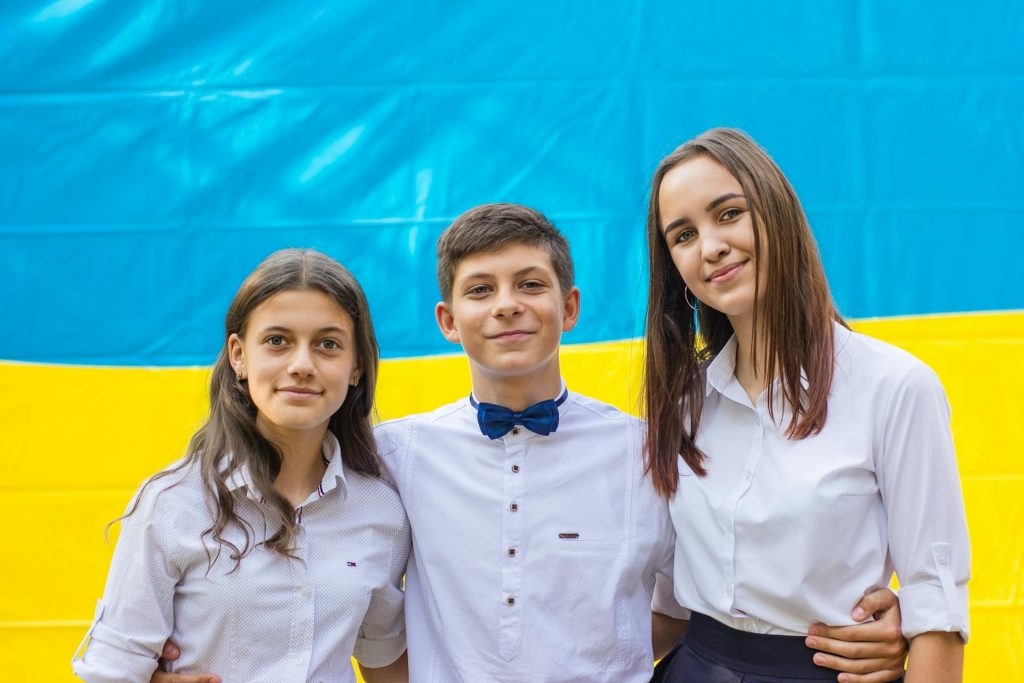Gratitude shortages: kids smiling in front of ukrainian flag Due to recent requests from Ukrainian families plus local families in need, we are asking for help
